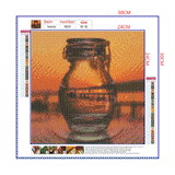Full Diamond Painting kit - Reflection of the sunrise in a glass bottle